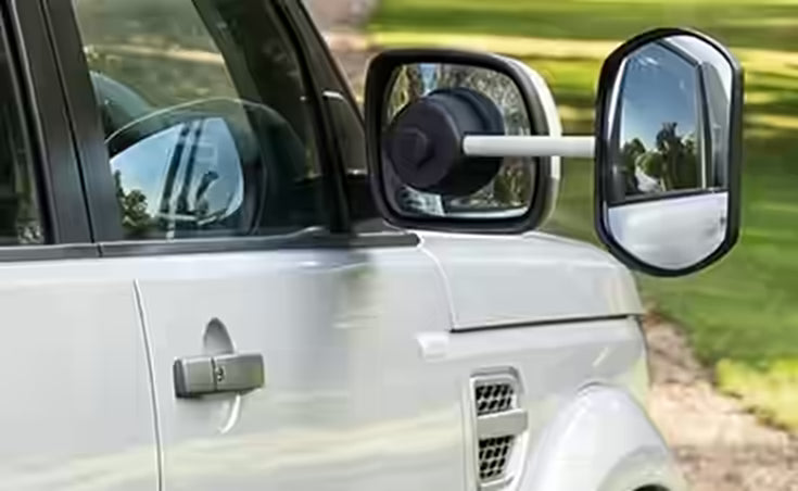 SUV wing mirror with an extension towing mirror attached